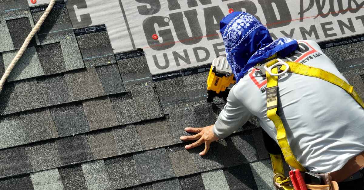 A Tamko contractor replacing a roof