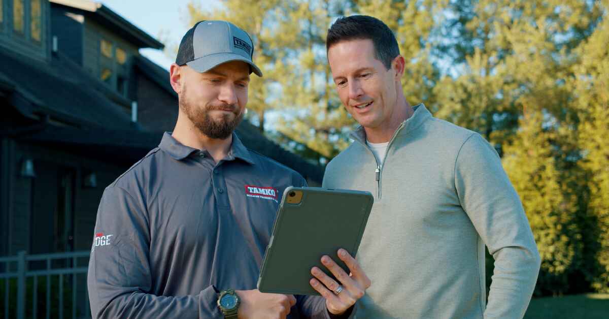 Tamko contractor talking with a customer