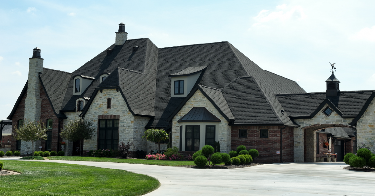 A aerial view of a large home with a tamko roof