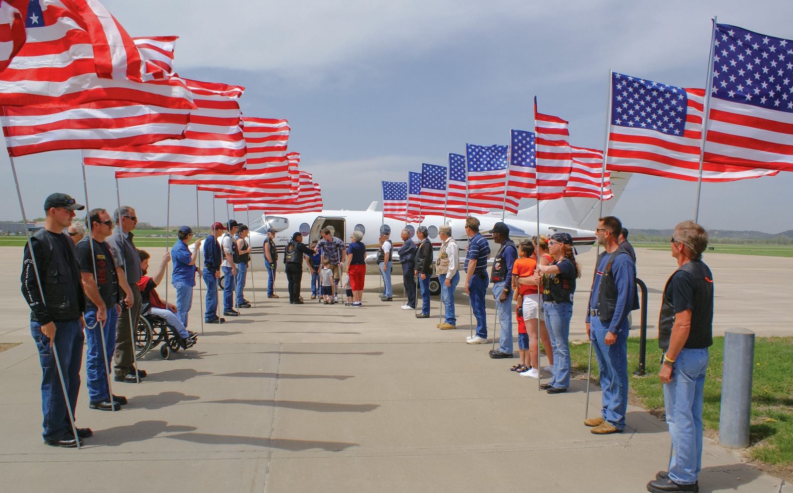 TAMKO&#39;s first-ever VAC Hero Flights mission - veteran welcomed home with flags - May 2008