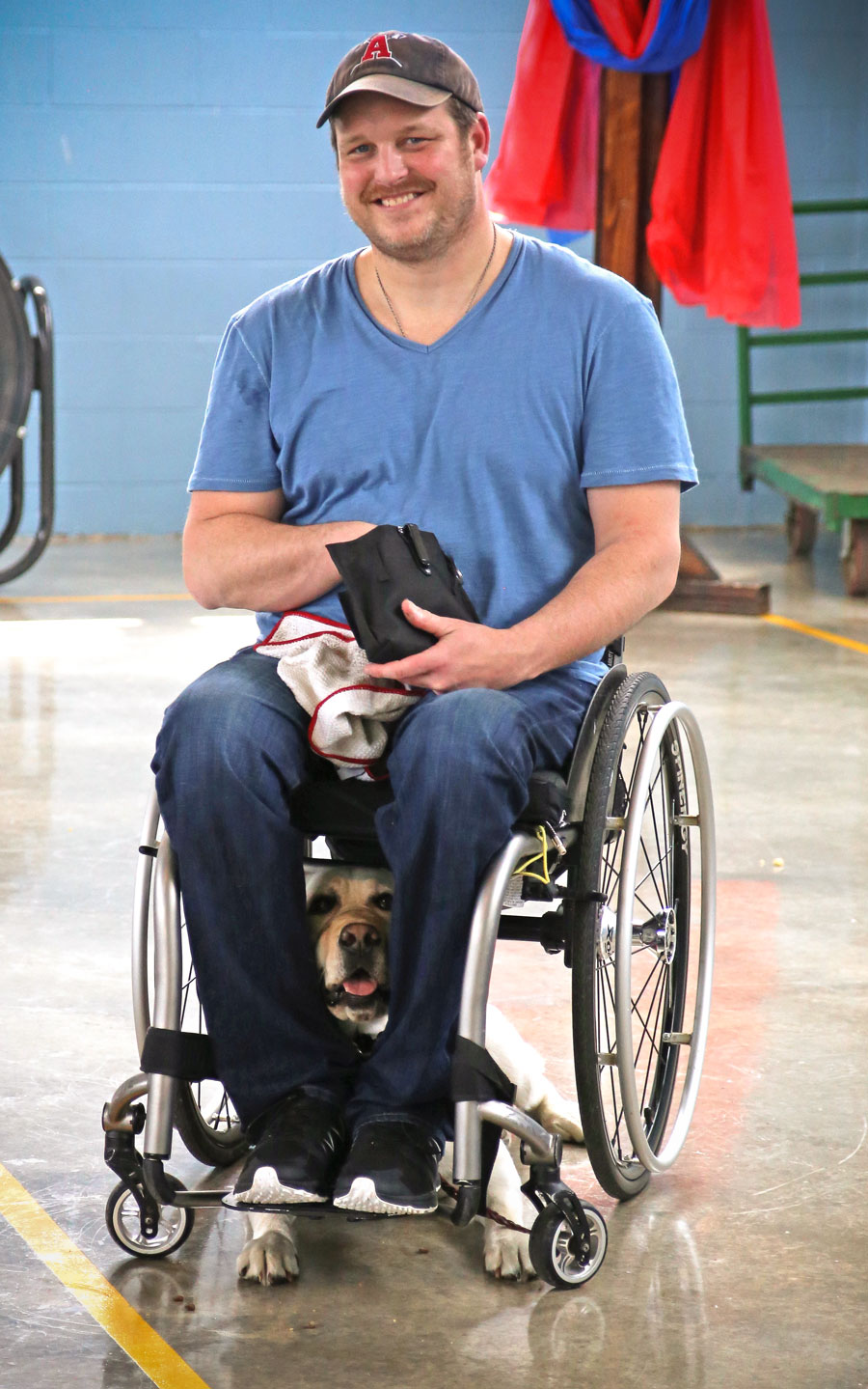 Veteran in wheelchair with service dog